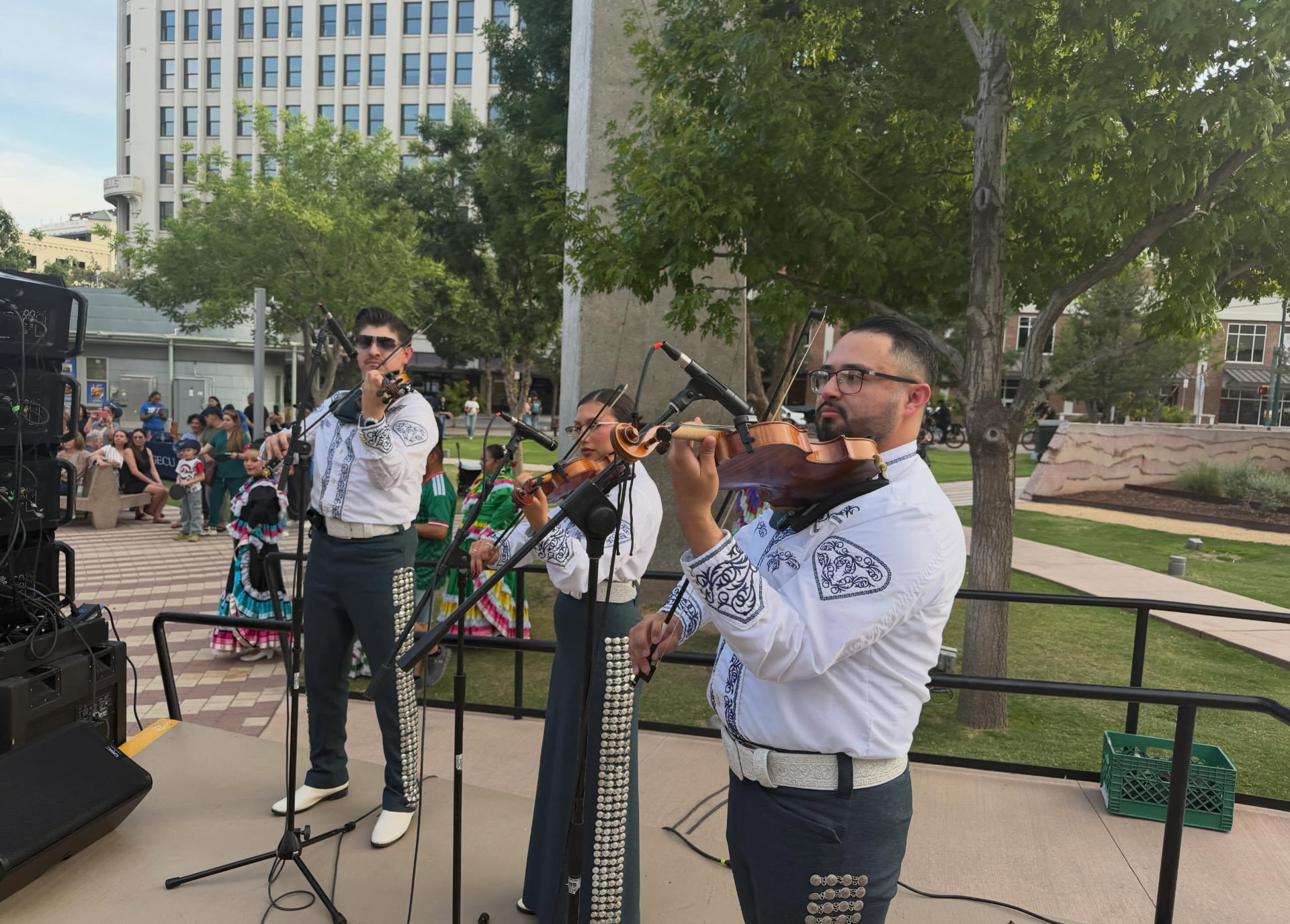 Mariachi Alegre violinists performing on stage