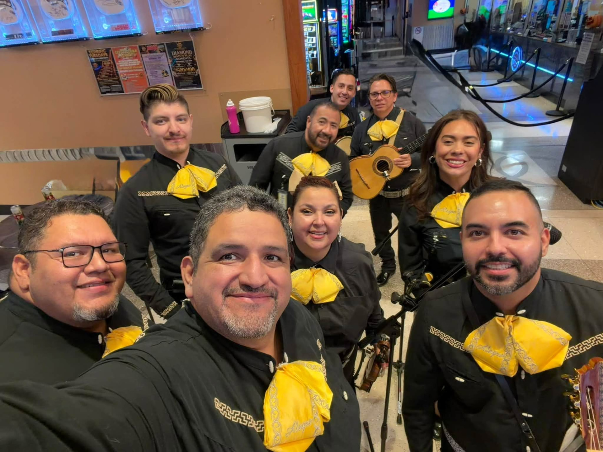 Mariachi Alegre in black and gold charro suits backstage