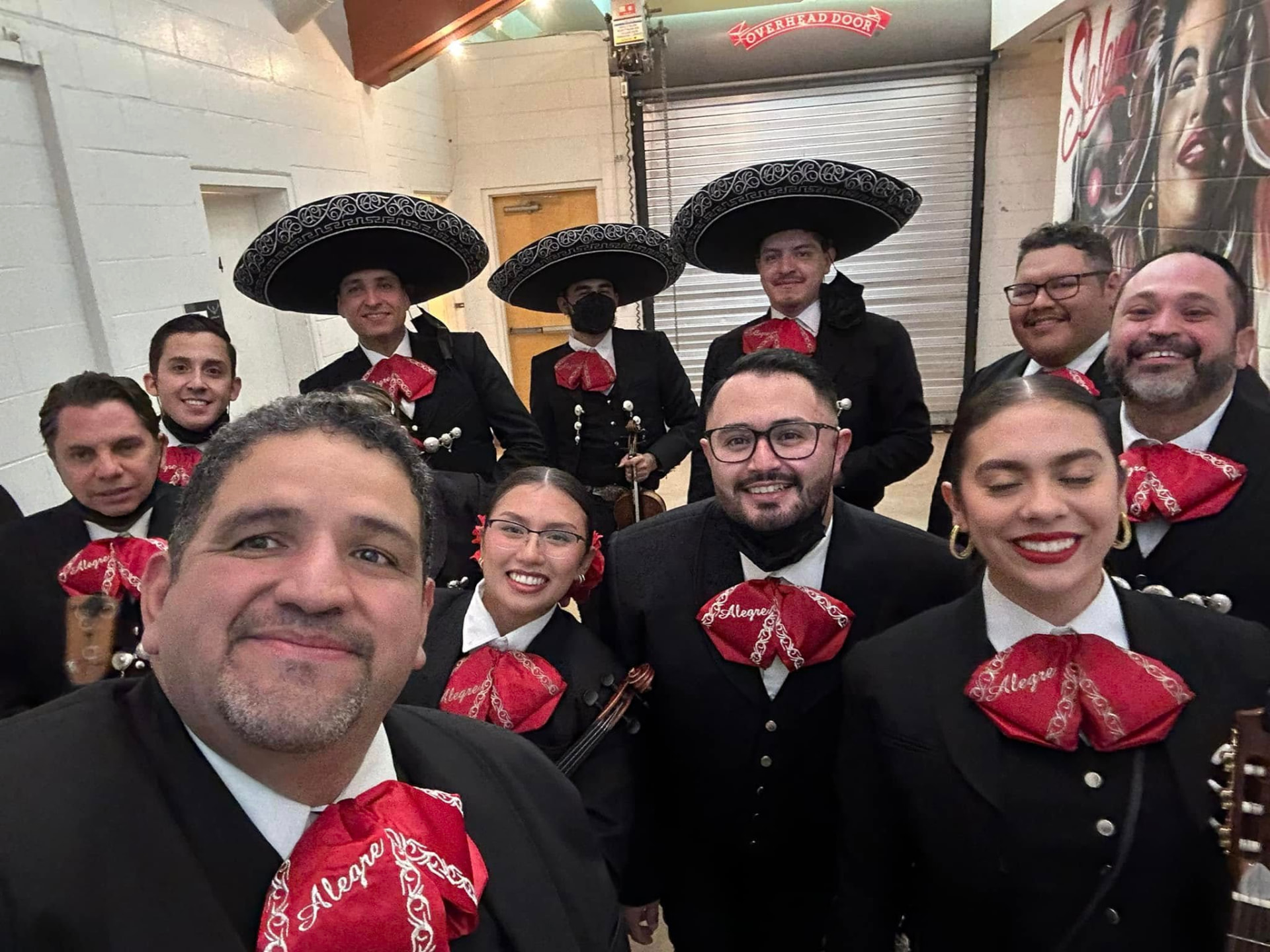 Mariachi Alegre in black charro suits with red ties