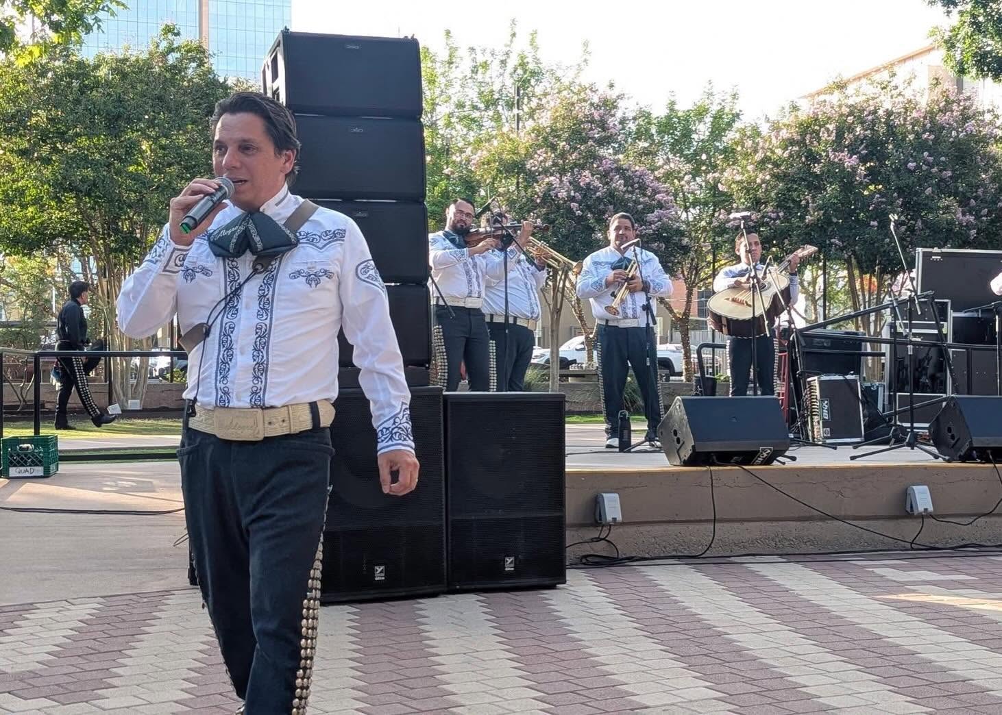 Mariachi Alegre singer performing in front of the stage