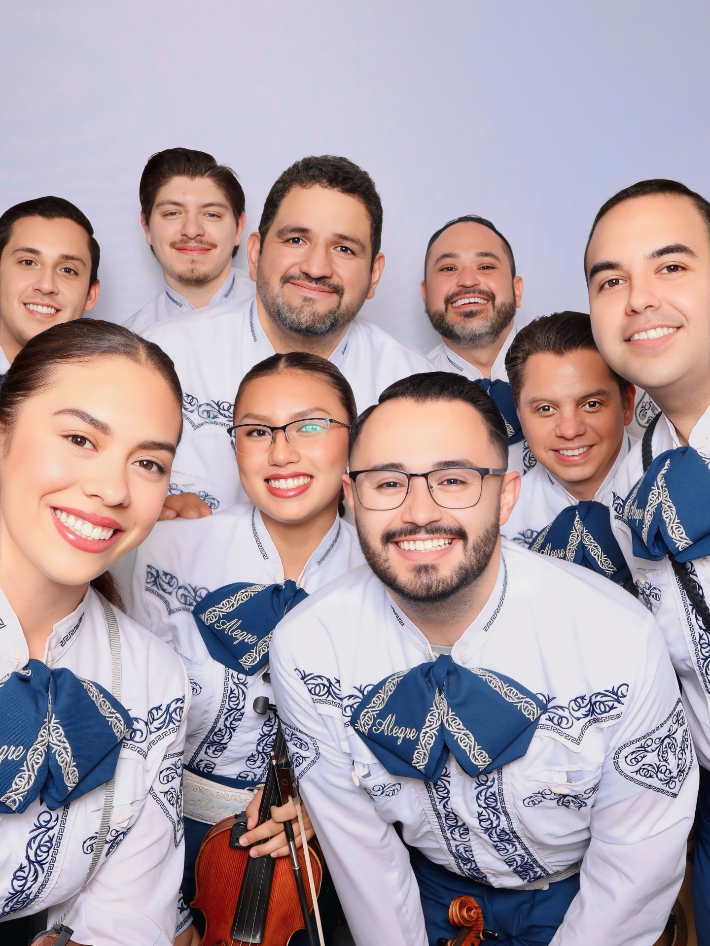 Mariachi Alegre group photo in white charro suits